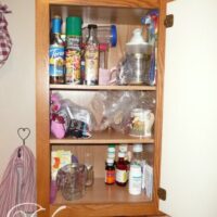 Cabinet by stove cleaned out