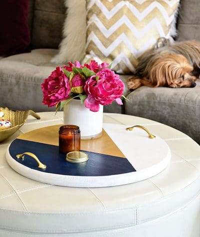 A bold colorful tray is the perfect way to add a pop of color to a space and use it as a serving tray when entertaining. The color blocking gives this tray a modern look while the touch of gold adds a little elegance! Get the full tutorial to make your own DIY Color Block Tray at TidyMom.net