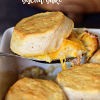 Tender chicken breasts in a cheesy white sauce are topped with homestyle biscuits this Chicken and Cheese Biscuit Bake. It’s simple one-dish meal the whole family will love! Get the easy recipe at TidyMom.net