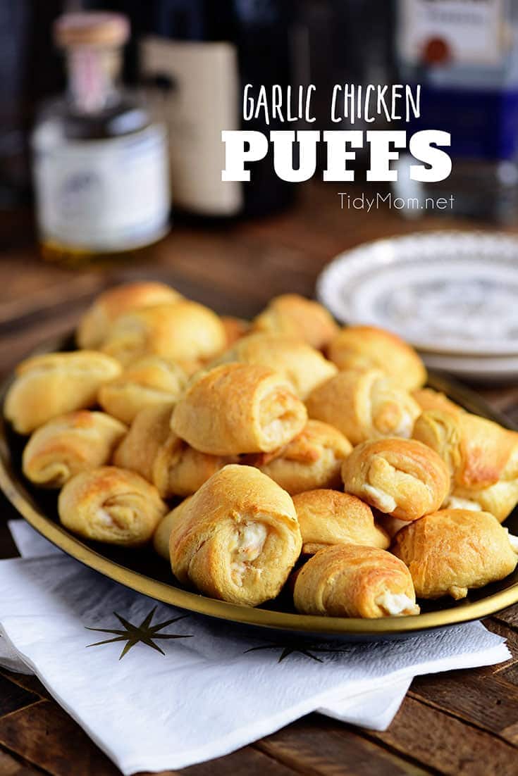 Garlic Chicken Puffs have a rich creamy garlic chicken mixture inside a croissant and baked to form a yummy appetizer. This finger food is a big crowd pleaser and great for gatherings! Print recipe at TidyMom.net