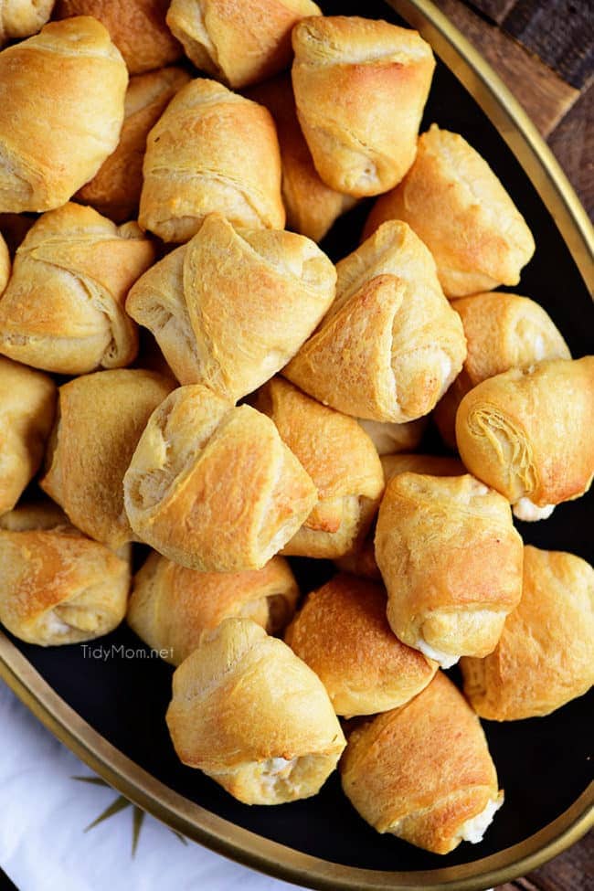 Garlic Chicken Puffs have a rich creamy garlic chicken mixture inside a croissant and baked to form a yummy appetizer. A big crowd pleaser and great for gatherings! Print recipe at TidyMom.net