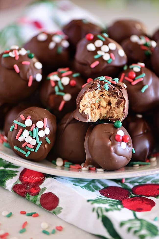 peanut butter balls with Christmas sprinkles on a plate