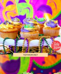 mardi gras cupcakes on a white platter