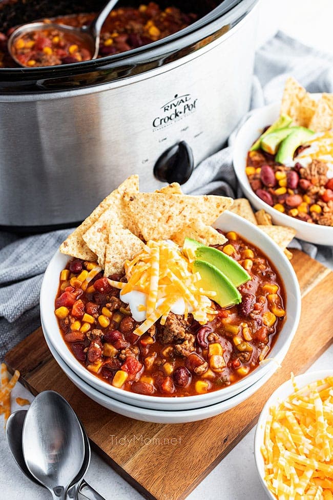 taco soup on a bowl in front of a slow cooker