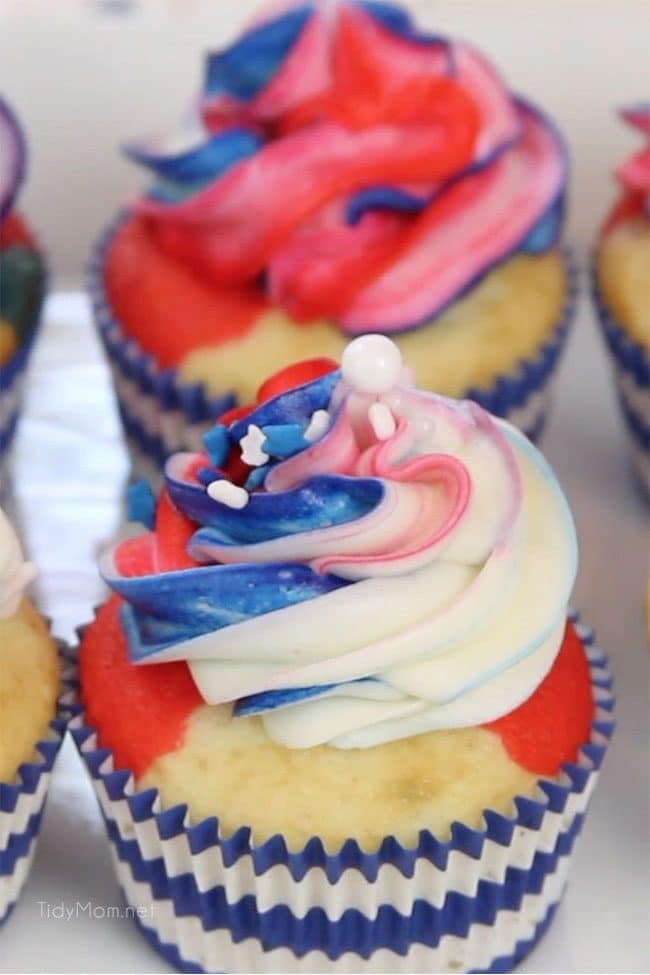 If you are looking for patriotic cupcakes for your next party, these Red White and Blue Cupcakes are sure to spark their attention and earn salutes at any Memorial Day and 4th of July celebrations. Step-by-step directions and recipe + video at TidyMom.net #cupcakes #patriotic #redwhiteandblue