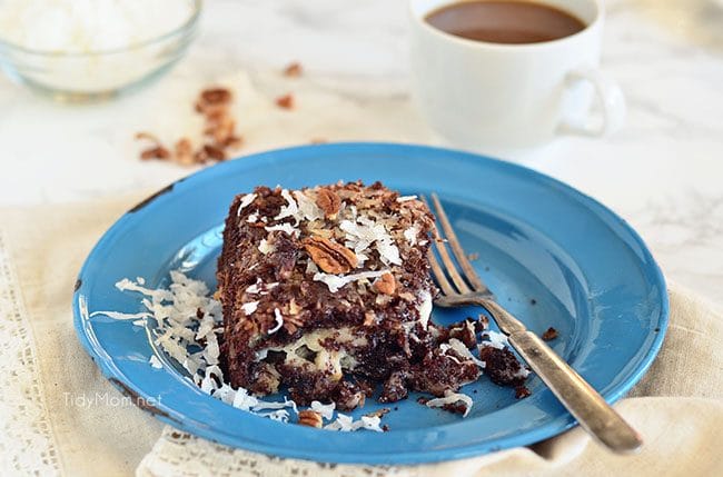 Gooey Upside Down German Chocolate Cake on blue plate