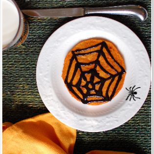 spooky pumpkin pancakes with black cinnmon syrup at TidyMom.net