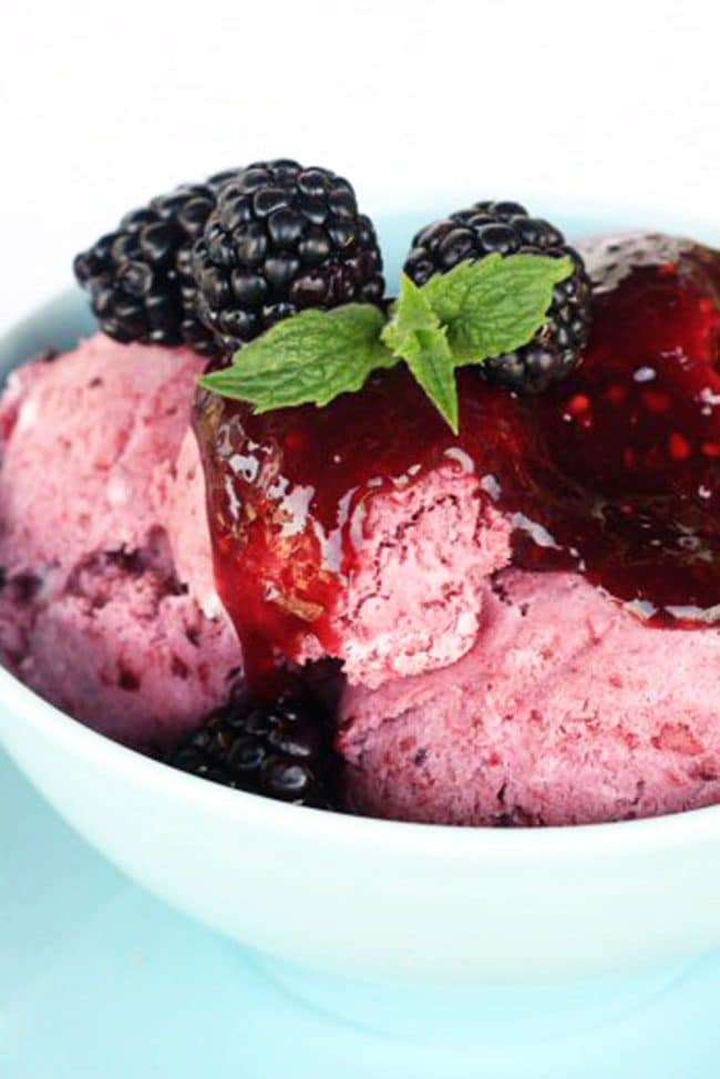 Blackberry no-churn ice cream in a bowl with mint garnish