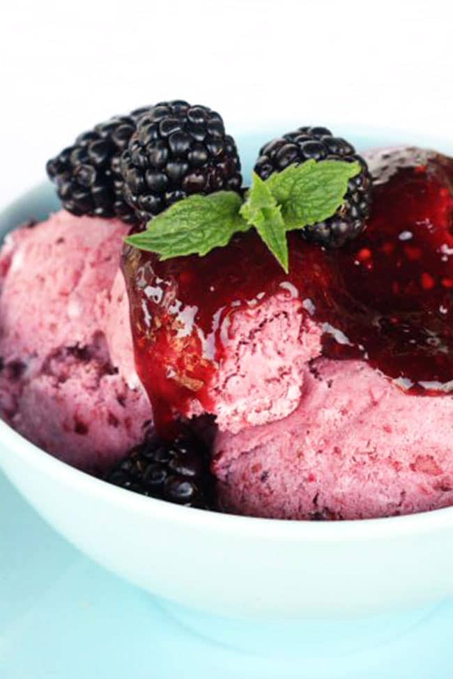 Blackberry no-churn ice cream in a bowl with mint garnish