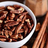 close up of toasted pecans with cinnamon