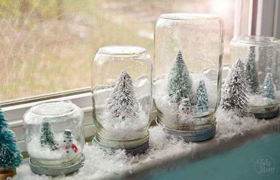 homemade waterless snow globes in a window