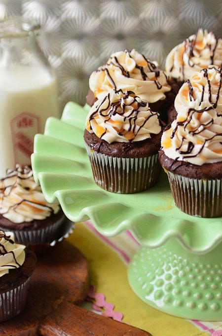 Baileys Irish Cream Cupcakes are filled with a chocolate caramel ganache surprise. Taken up one more notch with a rich buttercream spiked with a dose of Irish Cream on top. The perfect St. Patrick's Day treat. Full, printable recipe at TidyMom.net