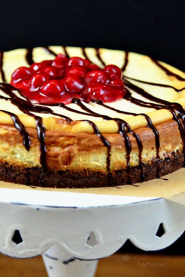 Brownie Cherry Cheesecake on cake stand
