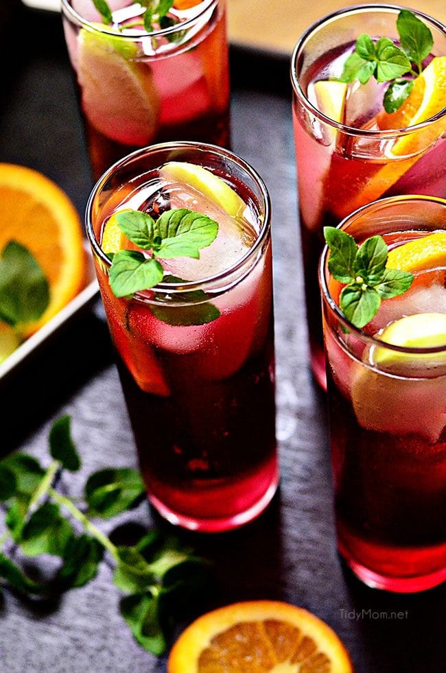 Pomegranate Spritzers with fresh citrus slices.