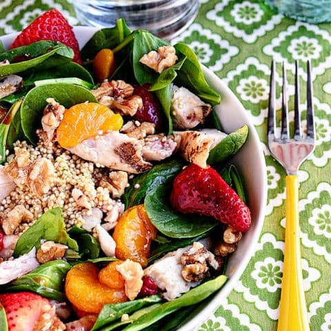 A hearty spring Strawberry Orange Spinach Salad with Quinoa is full of protein. Perfect for lunch or dinner on warm spring days. Print Full Recipe at TidyMom.net