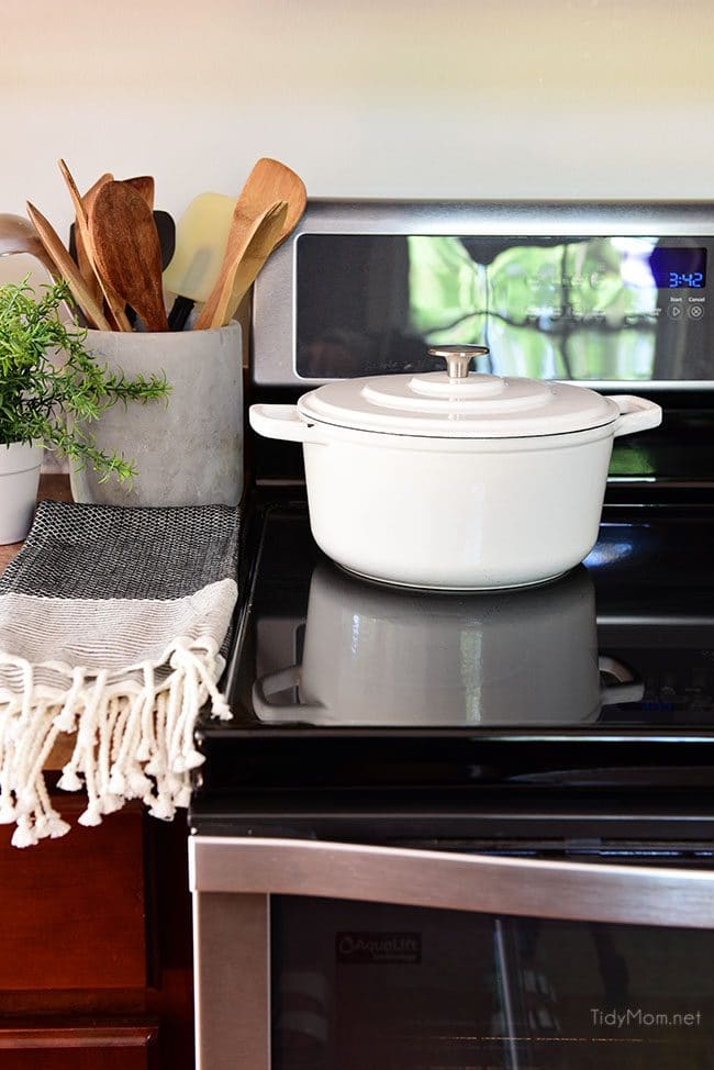 clean glass cooktop with white pot