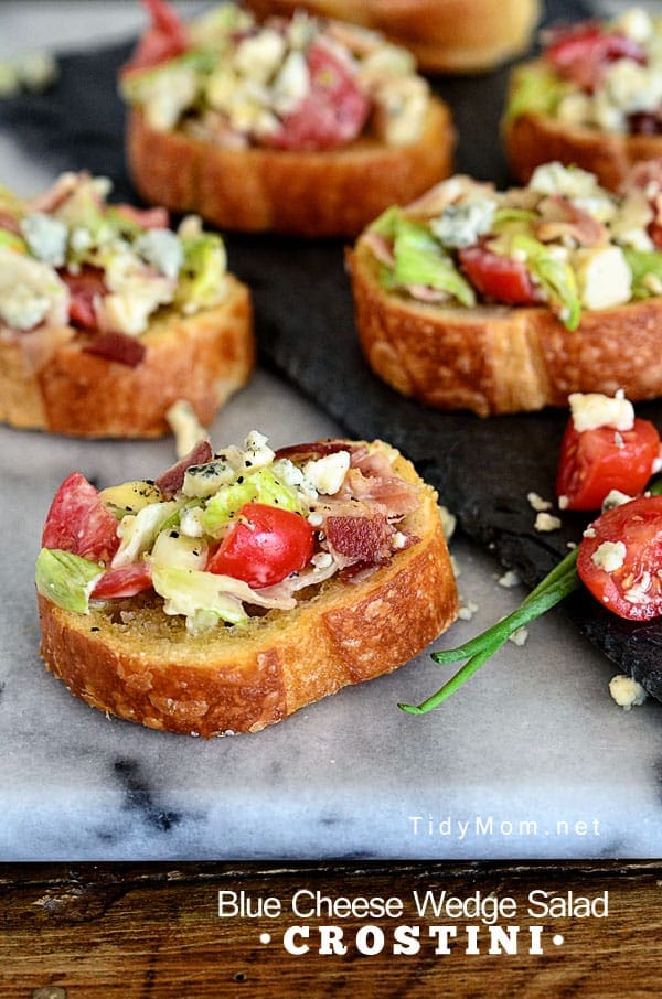 Salad becomes finger food when you serve it on a crostini. This simple yet delicious Blue Cheese Wedge Salad Crostini appetizer can be whipped up in under 20 minutes for any party or lunch. Print this appetizer recipe at TidyMom.net