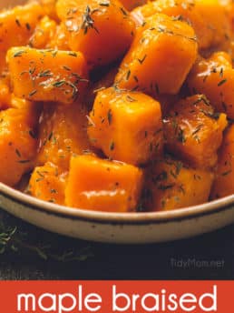 braised butternut squash in a bowl with thyme