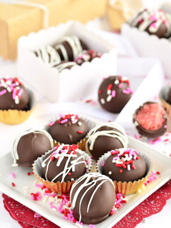 strawberry cake balls in bakery boxes