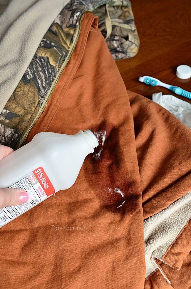 pouring rubbing alcohol on jacket