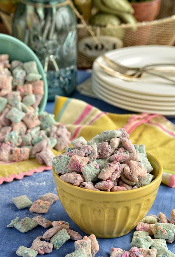 multi-colored Cake Batter Puppy Chow snack mix in a bowl