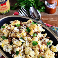 The BEST Roasted Cauliflower recipe with Italian dressing, feta cheese and browned butter crouton crumbs at TidyMom.net
