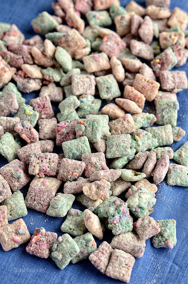 a pile of pastel colored cake batter puppy chow snack mix