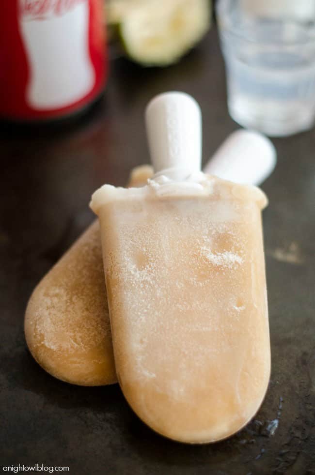 "Dirty" Coca-Cola Popsicles! The perfect summer flavor combo of Coke with a hint of lime, coconut and cream! You've got to try it! recipe at TidyMom.net