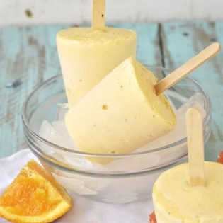 The delicious combination of vanilla ice cream and orange juice make a Creamy Orange Creamsicle- recipe at TidyMom.net