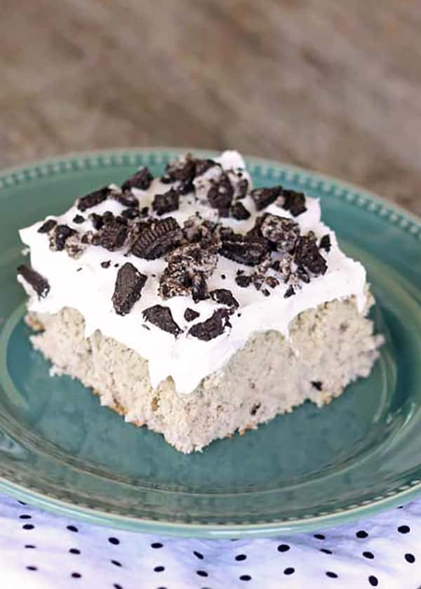 The perfect dessert for potlucks- Cookies and Cream Poke Cake recipe at TidyMom.net