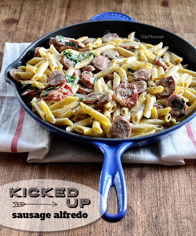 Savory smoked turkey sausage combined with sun-dried tomatoes, garlic, spinach, and Parmesan cheese make this a sensational 15-minute Smoked Sausage Alfredo recipe the whole family will love. Get the full printable recipe at TidyMom.net