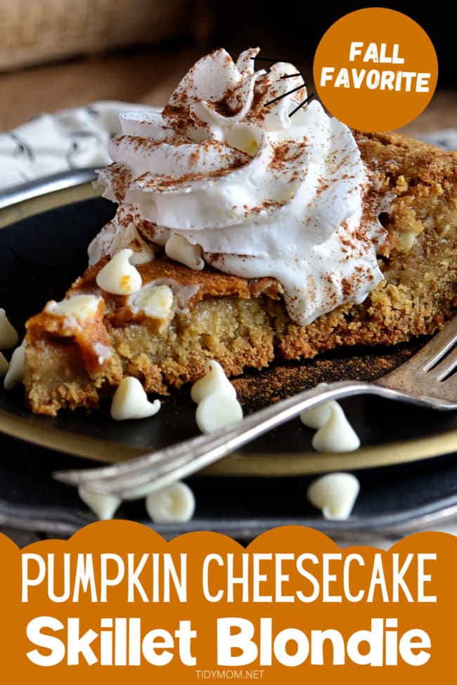 Pumpkin Cheesecake Skillet Blondie on a black plate with a fork