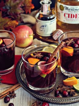 Mulled Wine or Glühwein is a warm winter German version of sangria that tastes like Christmas. Start a new family tradition with this belly-warming hot holiday punch recipe at TidyMom.net