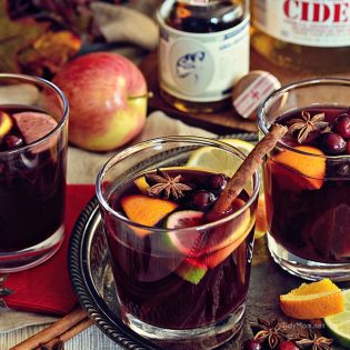 Mulled Wine or Glühwein is a warm winter German version of sangria that tastes like Christmas. Start a new family tradition with this belly-warming hot holiday punch recipe at TidyMom.net