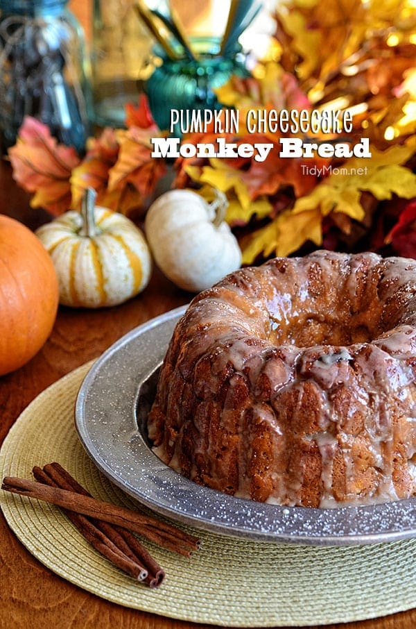 Pumpkin Cheesecake Monkey Bread is all gussied up for autumn with pumpkin, fall spices and a sweet maple glaze. Recipe at TidyMom.net