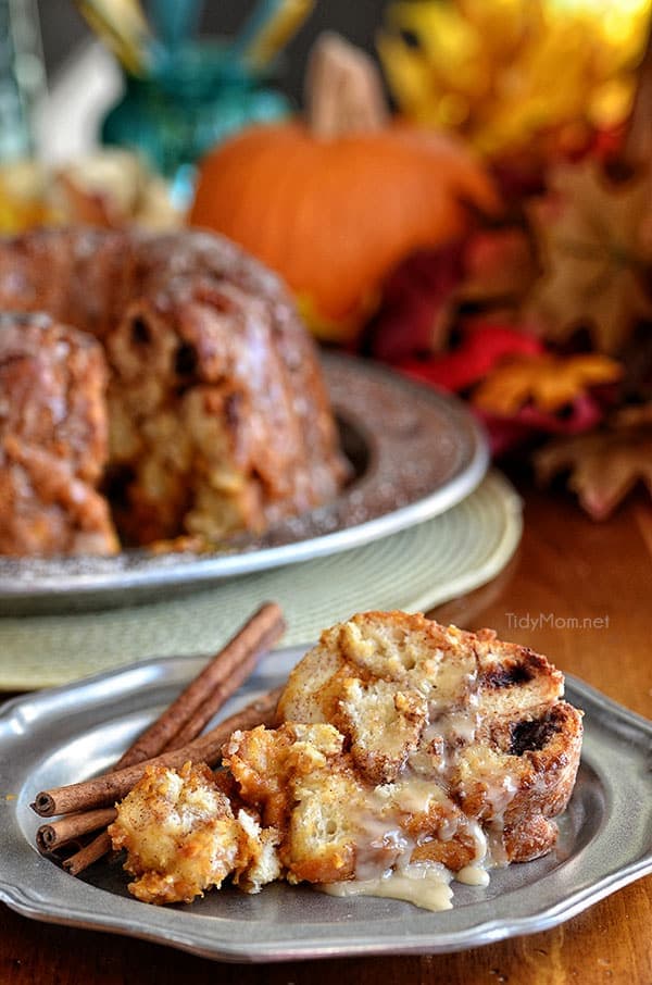 Pumpkin Cheesecake Monkey Bread is all gussied up for autumn with pumpkin, fall spices and a sweet maple glaze. Pull apart Recipe at TidyMom.net