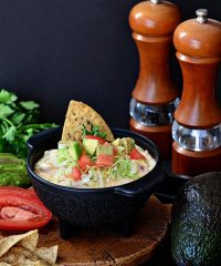 White Chili Bean Queso Dip with zesty tomatoes, cheese and Bush's white chili beans served warm with tortilla chips is sure to be a hit at any party. recipe at Tidymom.net