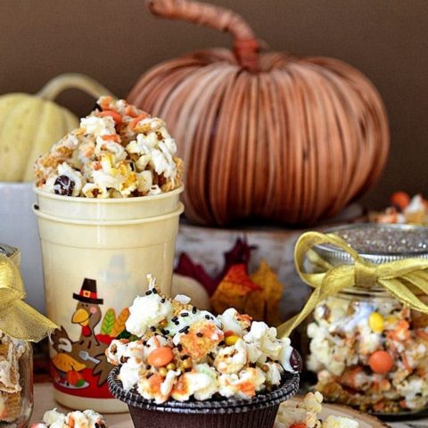 Turkey Munch - Fall Popcorn Snack Mix with bugles, reeses pieces and sprinkles all drizzled in white chocolate and pumpkin candy melts. Recipe at Tidymom.net