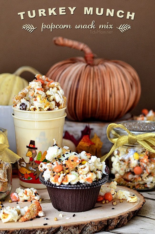 Turkey Munch - Fall Popcorn Snack Mix with bugles, reeses pieces and sprinkles all drizzled in white chocolate and pumpkin candy melts. Recipe at Tidymom.net