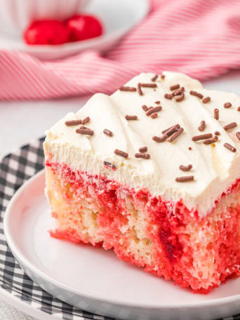 a serving of red and white poke cake