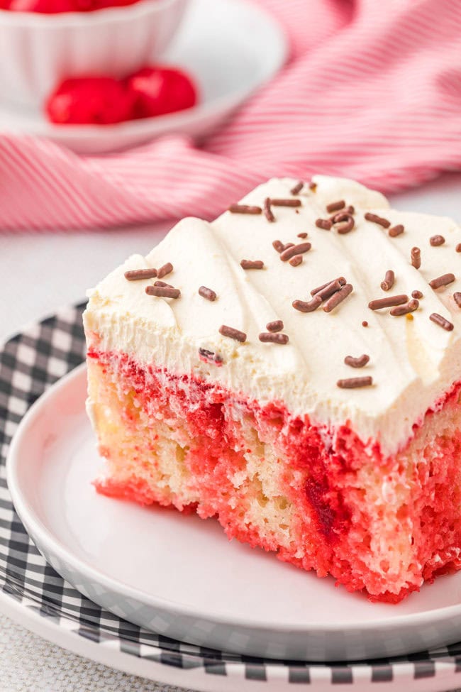 a serving of red and white poke cake