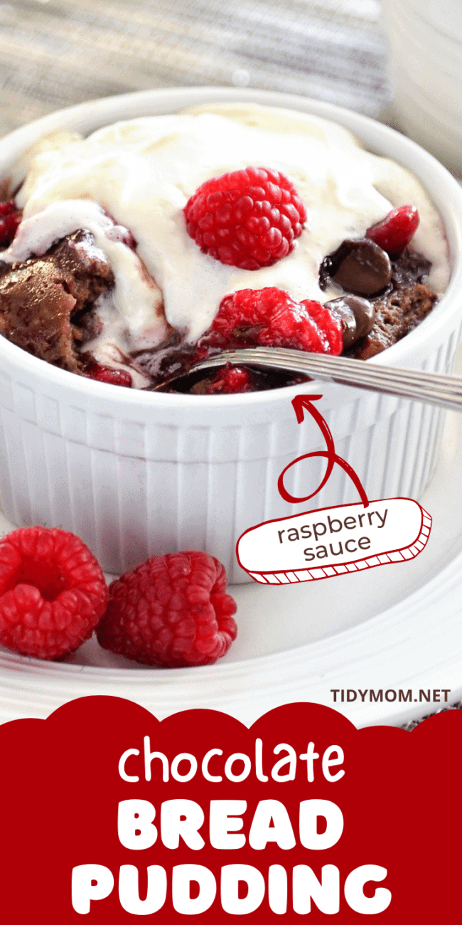 chocolate bread pudding in a white dish with fresh raspberries