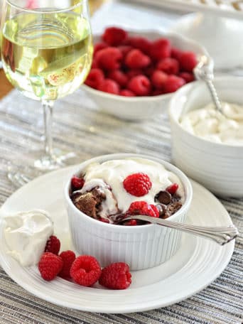 Dark Chocolate Bread Pudding with raspberry sauce and Bailey's Whipped Cream recipe at TidyMom.net