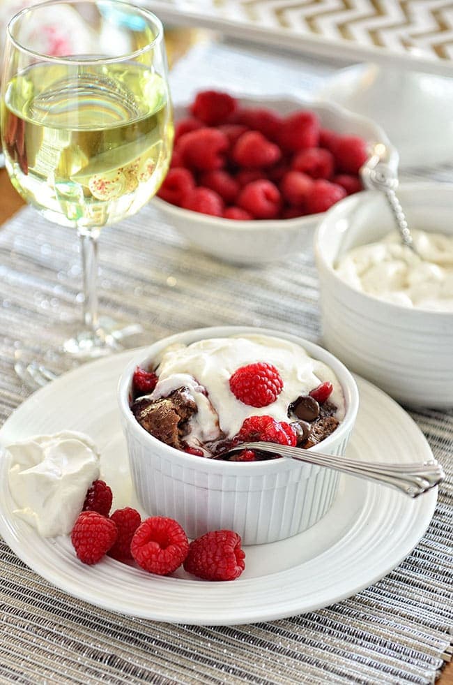 Dark Chocolate Bread Pudding with raspberry sauce and Bailey's Whipped Cream recipe at TidyMom.net