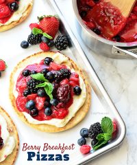 Mixed Berry Breakfast pizza tastes as good as it looks! It's impossible to resist the toasted pita crust, rich orange cream cheese layer and glossy berry topping. It's so convenient to prepare the night before and serve the next morning, or any time of day! Full recipe at TidyMom.net