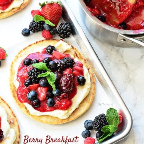 Mixed Berry Breakfast pizza tastes as good as it looks! It's impossible to resist the toasted pita crust, rich orange cream cheese layer and glossy berry topping. It's so convenient to prepare the night before and serve the next morning, or any time of day! Full recipe at TidyMom.net