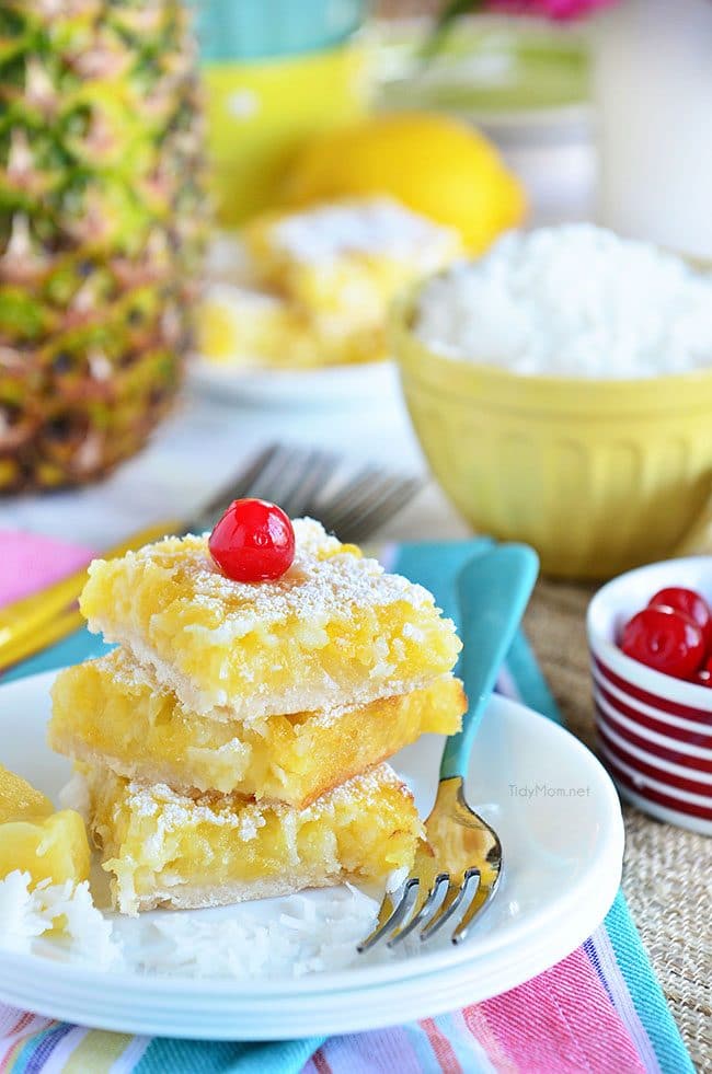 Channel the tropics, lounging on a white sandy beach, with these Pina Colada Bars. Enjoy the flavors of coconut and pinaple and consider it your ticket to a mental tropical paradise. grab the recipe at TidyMom.net