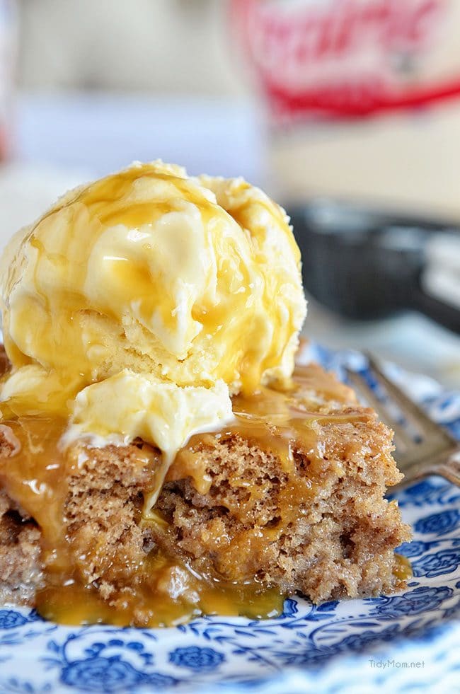 Easy Cinnamon Roll Poke Cake with vanilla ice cream on top