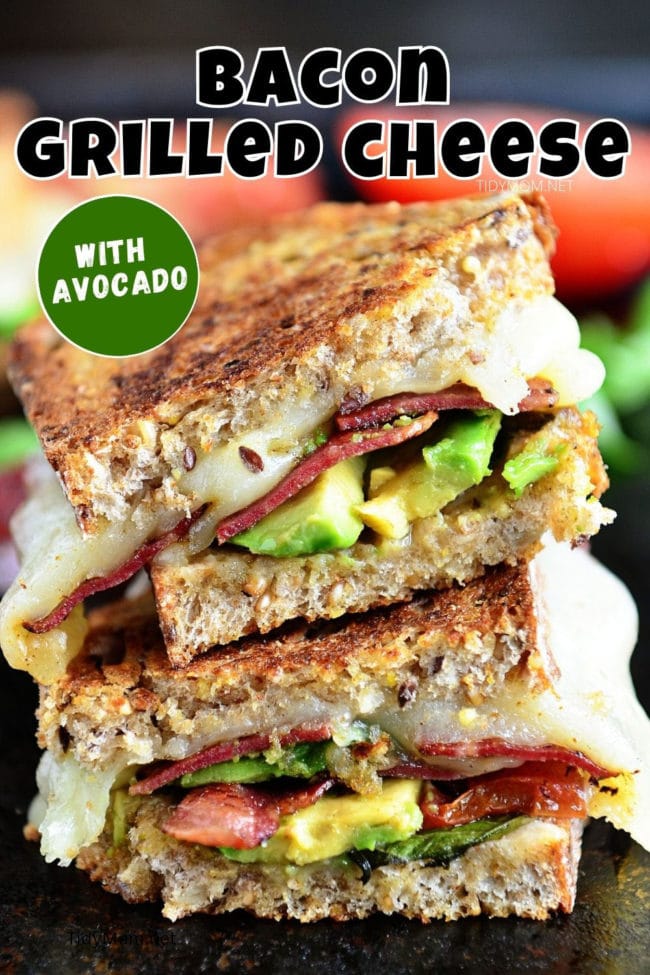 grilled cheese sandwich with bacon and avocado cut in half and stacked
