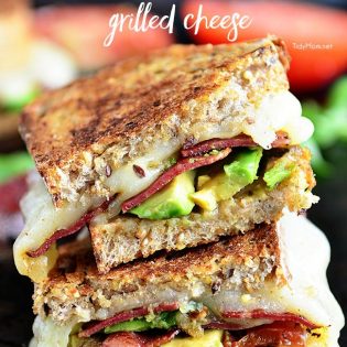 Turkey Bacon and Avocado Grilled Cheese sandwich loaded with fresh basil, tomatoes and mozzarella cheese on a hearty artisan bread. Recipe at TidyMom.net